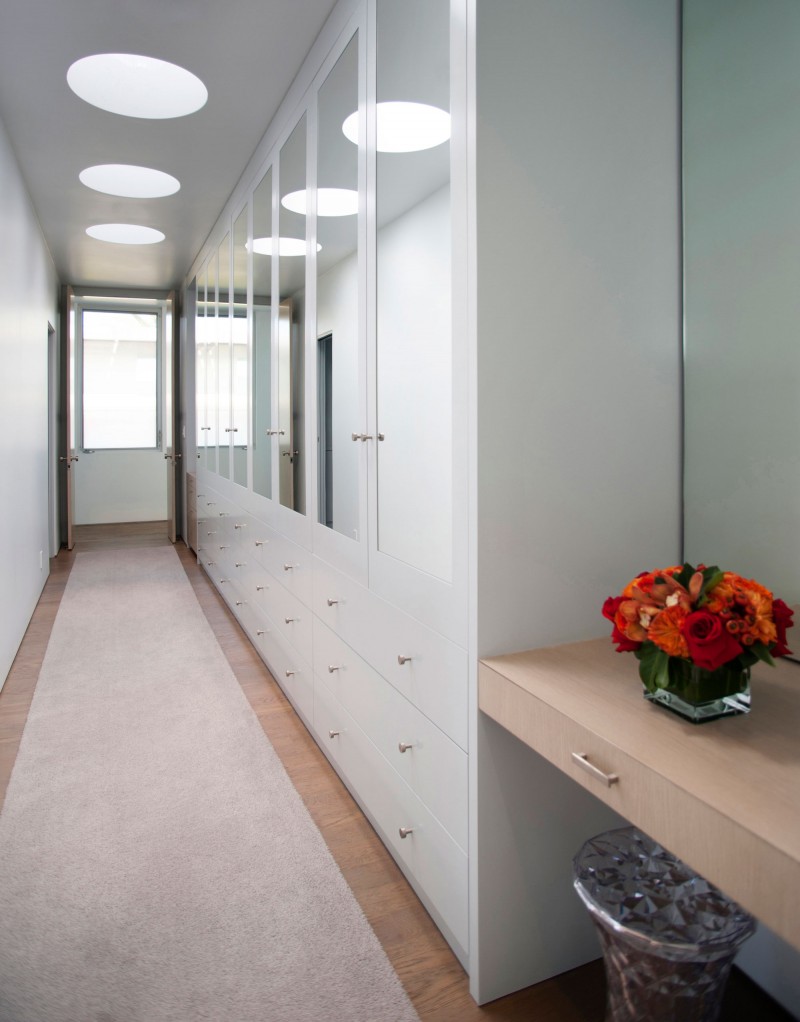 Walk In The Stunning Walk In Closet Inside The Modern Family Residence With White Drawers And White Cabinets Near Mirrored Doors Dream Homes Duplex Contemporary Concrete Home With Outdoor Green Gardens For Family