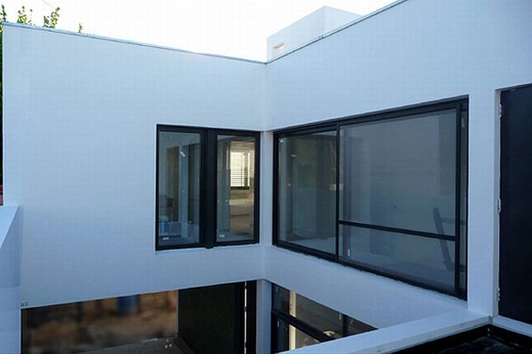 White Concerete Cube Stunning White Concrete Material And Cube Shape Building With Large Window Of Casa Dorrego In Argentina  Bright And White Exterior Color Schemes For Your Modern House