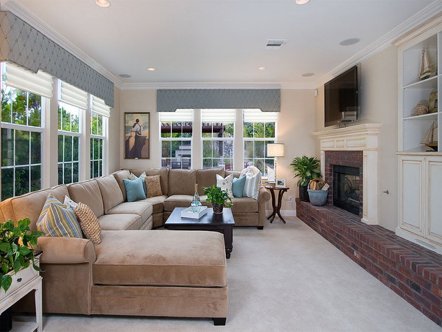 Styled Narrowed Featured Vintage Styled Narrowed Family Room Featured With Brick Fireplace And Cream Velvet Sofa Sectionals With Table Apartments Fancy Modern Sectional Sofas Creates Elegant Living Spaces And Nuance