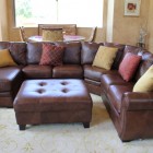 Dark Brown Sofa Warm Dark Brown Leather Sectional Sofa Coupled With Tufted Ottoman To Contrast Yellow And Maroon Pillows Dream Homes Enchanting Leather Sectional Sofa For Various Living Room Layouts (+16 New Images)