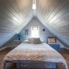 Gray Striped Attic Wonderful Gray Striped Ceiling For Attic Bedroom Ideas In Wooden Themes Involved Tulip Shaped Pendant Lamp And Gray Chair Beside The Bed Bedroom Elegant And Bright Bedroom Decoration With Glowing Sloped Ceilings