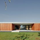 Back Space House Awesome Back Space Of The House In Villarcaya With Concrete Terrace And Brown Chairs Near Grass Yard Architecture Chic Spanish Home Design With Grey Concrete Floors