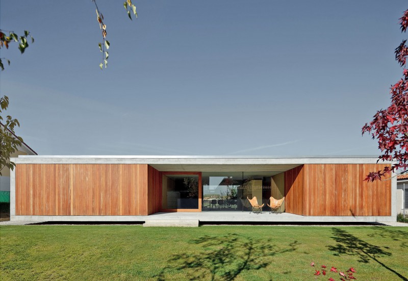 Back Space House Awesome Back Space Of The House In Villarcaya With Concrete Terrace And Brown Chairs Near Grass Yard Architecture Chic Spanish Home Design With Grey Concrete Floors