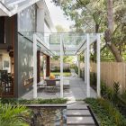 Landscape Garden Modern Awesome Landscape Garden Outside The Modern House With Natural Pond And Pebbles Also Concrete Pathway Architecture Sleek And Bright Contemporary Home With Cool Glass-Roofed Pergola
