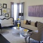 Home Living Furnished Bright Home Living Room Interior Furnished With Patterned Loveseat Sofa And Wing Chair Put On Sunburst Rug Decoration Spectacular Home Interior Design With Vibrant Rug And Patterns