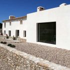 White Painted In Bright White Painted Artists Retreat In Andalucia Spain Building Completed With Mounts Of Gravels And Stone Clad Apartments Picturesque Contemporary Farmhouse In Beautiful Stone And White Interiors