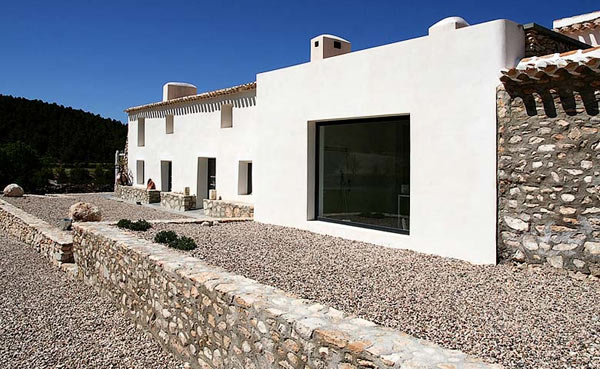 White Painted In Bright White Painted Artists Retreat In Andalucia Spain Building Completed With Mounts Of Gravels And Stone Clad Apartments Picturesque Contemporary Farmhouse In Beautiful Stone And White Interiors