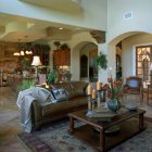 Mediterranean Family Cozy Charming Mediterranean Family Room With Cozy Leather Sofa And Wood Coffee Table Tribal Pattern Carpet Natural Greenery Sustainable Home Plans Architecture Warmth Contemporary Sustainable Home With Neat Garden Arrangements