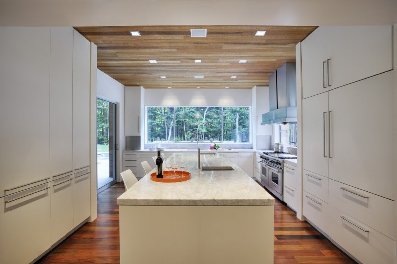 White Kitchen Hill Fascinating White Kitchen In Qual Hill House With Long Island And White Stools On Hardwood Floor Architecture Striking And Creative Modern Home With Personal Art Galleries