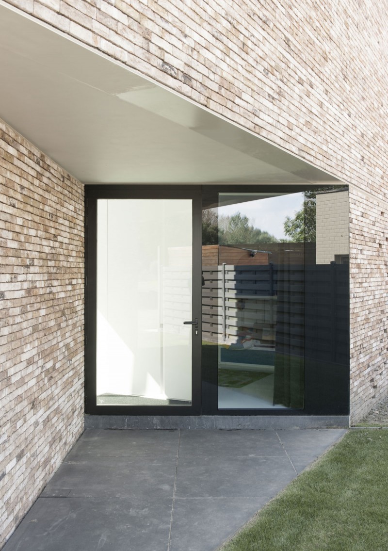 House K Modern Imposing House K Exterior With Modern Glass Door On Corner Dark Concrete Floor Rough Brick Wall Grassy Yard Dream Homes Stunning Contemporary House With Bright Black And White Colors