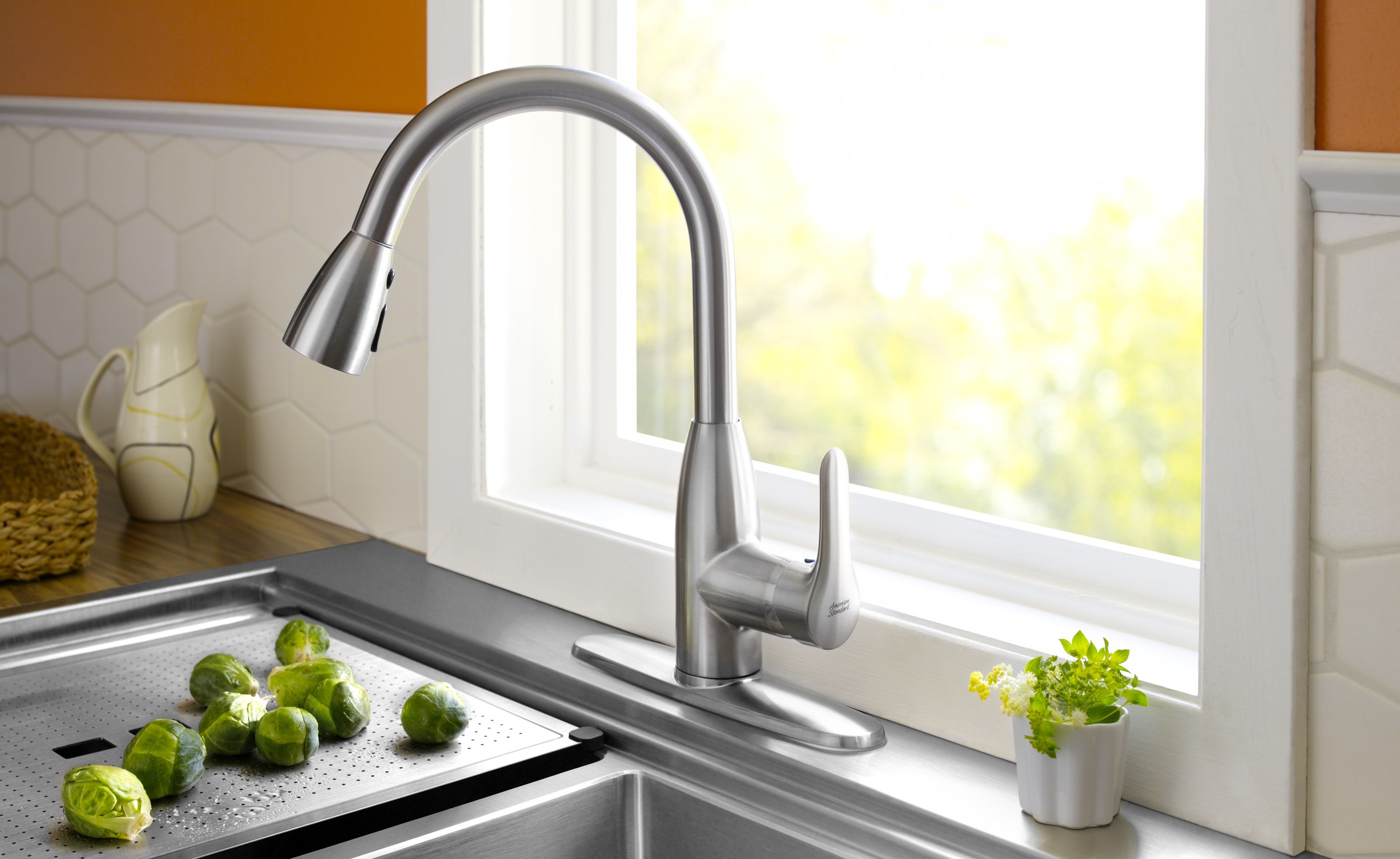 White Framed Stainless Interesting White Framed Window Beside Stainless Steel Kitchen Faucet And Glossy Sink Near White Backsplash Kitchens  10 Stainless Steel Kitchen Faucet To Complement The Functionality