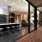 Corallo House Arquitectura Modern Corallo House By Paz Arquitectura Cooking Room Featured With Breakfast Bar Involving Stools And Stove Architecture Natural Concrete Home With Wooden Floor And Glass Skylight