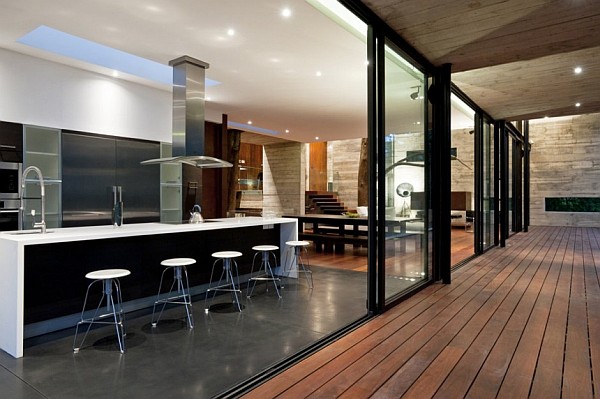 Corallo House Arquitectura Modern Corallo House By Paz Arquitectura Cooking Room Featured With Breakfast Bar Involving Stools And Stove Architecture Natural Concrete Home With Wooden Floor And Glass Skylight