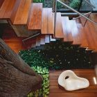 Corallo House Arquitectura Natural Corallo House By Paz Arquitectura Indoor Wooden Staircase With Metallic Balustrade Displaying Indoor Garden Architecture Natural Concrete Home With Wooden Floor And Glass Skylight