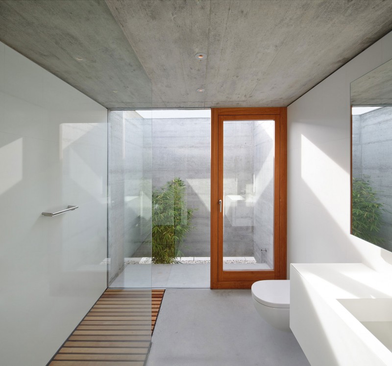 Bathroom In In Simple Bathroom In The House In Villarcaya With White Sink And Glass Shower Space Under Concrete Ceiling Architecture Chic Spanish Home Design With Grey Concrete Floors