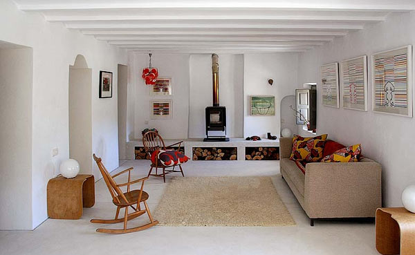 White Painted In Spacious White Painted Artists Retreat In Andalucia Spain Living Room Warmed Up By Fireplace With Firewood Storage  Picturesque Contemporary Farmhouse In Beautiful Stone And White Interiors