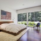Wooden Bed Quilt Wide Wooden Bed And White Quilt In The Qual Hill House Bedroom With Brown Bedside Tables Architecture Striking And Creative Modern Home With Personal Art Galleries