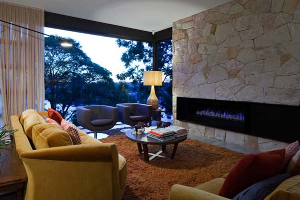 Living Room Sofas Breathtaking Living Room With Taupe Sofas Facing Circle Feat Books Feat Orange Color At The River House Dream Homes Luxurious And Cozy River House With Rectangle Swimming Pools