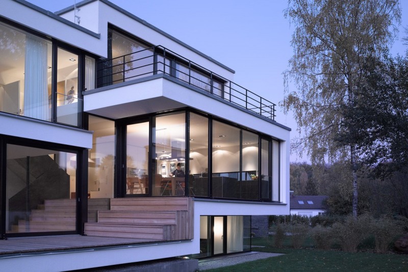 View By In Breathtaking View By Zochental Residence In The Left Side Showing Glass Wall And Door Design With Trees Standing The Front Of House Architecture Creative Glass Facade Of Unconventional Contemporary House Appearance