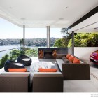 Open Living Nice Fresh Open Living Room With Nice Sofas Feat Orange And Brown Pillows Facing White Table At The River House Dream Homes Luxurious And Cozy River House With Rectangle Swimming Pools