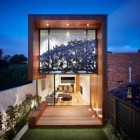 Facade View House Gravy Facade View By Treetop House With Glass Sliding Door Design And Wooden Deck That Showing Interior Area Architecture Comfortable Modern Home With Dazzling Glass Facades