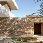 Stone Wall Chairs Great Stone Wall Outdoor White Chairs Round Glass Table Concrete Path Madison House In Modern Contemporary Dream Homes Spectacular And Spacious Contemporary House With Sliding Glass Walls