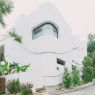 Green Greenberg With Innovative Green Greenberg Green House With Artistic Outdoor Wall Ornamental Plants In Concrete Planter Long Concrete Driveway Architecture Curvy Futuristic Home Presenting Futuristic Gray And White Themes