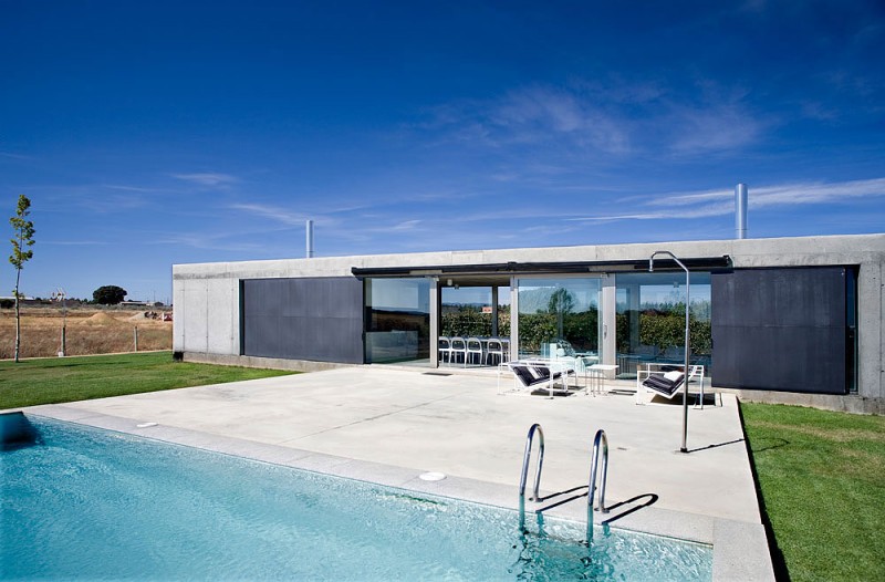 Court Between And Large Court Between Swimming Pool And The Home Building Can Be Used For Relaxation And Sunbathing Along Day  Rectangular Concrete Home With Swimming Pool And Natural Elements