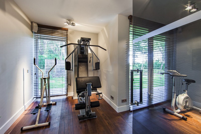 Gym Room Villa Mesmerizing Gym Room Design Of Villa In The Dunes With Dark Brown Wooden Floor And Several Metallic Gym Equipment Dream Homes  Cozy And Bright Modern Home Surrounded By Lush Forest Views