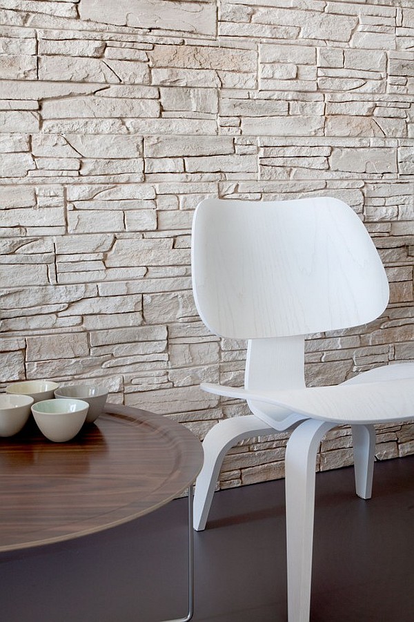 Stone Tiled As Natural Stone Tiled Wall Installed As Center Wall Of Apartment On The Waterfront Seating Area With Tray Table And Chair Apartments Scandinavian Interior Design With Minimalist Round Dining Table