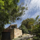 Balmain Residence Flair Peaceful Balmain Residence In Modern Flair Surrounded By Shady Greenery Rough Stone Garden Wall Sloping Driveway With Green Metallic Railing Architecture New Contemporary Home With Modern Interior And Traditional Exterior Elements