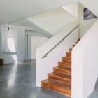 Marble Floor Staircase Sleek Marble Floor And Steep Staircase With Concrete Railing In Green Greenberg Green House Artistic Painting Minimalist White Door Architecture Curvy Futuristic Home Presenting Futuristic Gray And White Themes