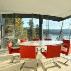 Red Colored Oval Surprising Red Colored Chairs Surrounding Oval Table In Cliff House By Mark Dziewulski Architect With Amazing Dining Room Architecture Waterfront Cliff House With Luxurious Furniture And Beautiful View