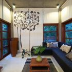 Tree Wall Dark Aesthetic Tree Wall Mural Cozy Dark Bed Sofa Asian Wood Coffee Table In Green House Bright Ceiling Lights Interior Design Eco-Friendly Modern Green Home With Exposed Red Brick Walls