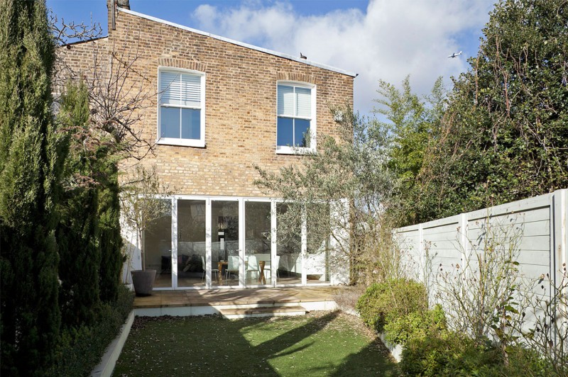 A Crisp Exterior Amazing A Crisp White Home Exterior Glass Door Precious Ornamental Plants Rustic Brick Wall Open Plan Interior Apartments Luminous And White Scandinavian Home With Exposed Eclectic Brick Facade