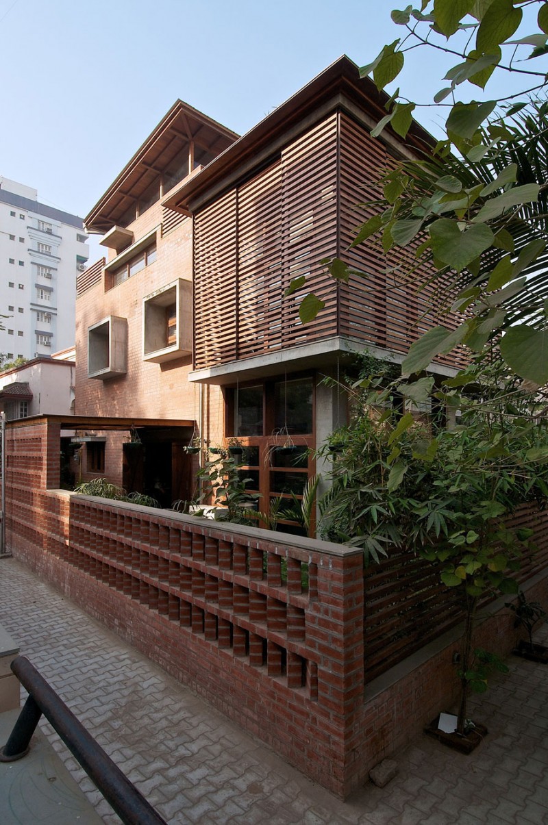 Green House Wood Appealing Green House Exterior With Wood Wall Cladding Artistic Brick Fence Ornamental Plants Square Glass Window Interior Design  Eco-Friendly Modern Green Home With Exposed Red Brick Walls