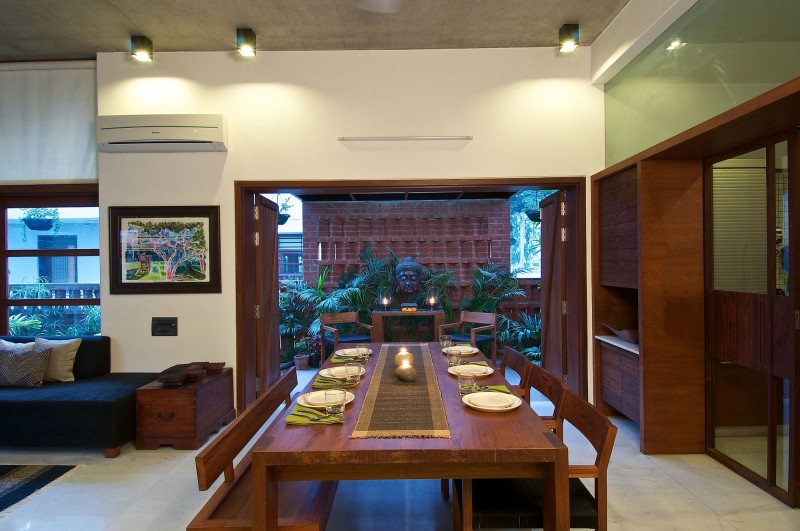 Painting Rectangular Table Artistic Painting Rectangular Wood Dining Table With Asian Tabletop Glaring Ceiling Lights Homey Green House Scenic Statue Interior Design Eco-Friendly Modern Green Home With Exposed Red Brick Walls