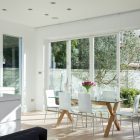 A Crisp Interior Bright A Crisp White Home Interior Rectangular Glass Dining Table And White Acrylic Chairs Compact Shaped Kitchen Furniture Apartments Luminous And White Scandinavian Home With Exposed Eclectic Brick Facade