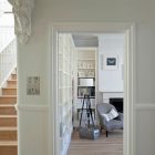 Pendant Light Crisp Chic Pendant Light In A Crisp White Home Antique Wood Staircase With White Railing Cozy Grey Chair And Modern Fireplace Apartments Luminous And White Scandinavian Home With Exposed Eclectic Brick Facade