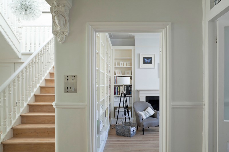 Pendant Light Crisp Chic Pendant Light In A Crisp White Home Antique Wood Staircase With White Railing Cozy Grey Chair And Modern Fireplace Apartments Luminous And White Scandinavian Home With Exposed Eclectic Brick Facade