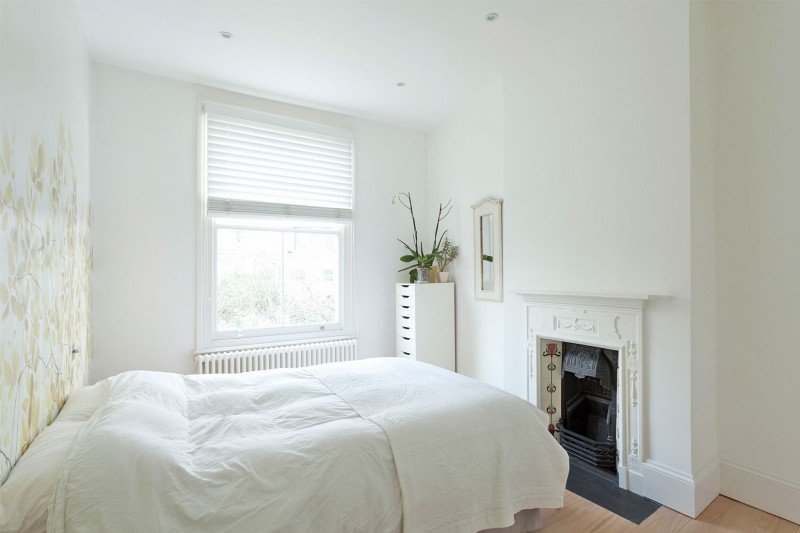 White Bed Cabinet Comfortable White Bed And Small Cabinet Flower Wall Mural Fake Flower Antique Fireplace In A Crisp White Home Apartments  Luminous And White Scandinavian Home With Exposed Eclectic Brick Facade