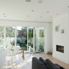 A Crisp Interior Fancy A Crisp White Home Interior With Rectangular Glass Dining Table And White Chairs Glass Pendant Lights Dark Sofa Modern Fireplace Apartments Luminous And White Scandinavian Home With Exposed Eclectic Brick Facade