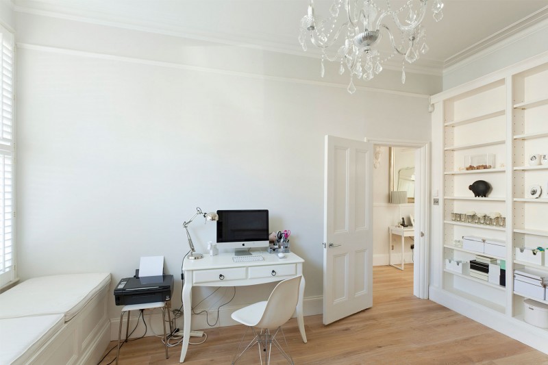 Crystal Chandelier Crisp Glamorous Crystal Chandelier In A Crisp White Home Large White Bookcase Small Computer Desk And Acrylic Chair Warm Wood Floor Apartments Luminous And White Scandinavian Home With Exposed Eclectic Brick Facade