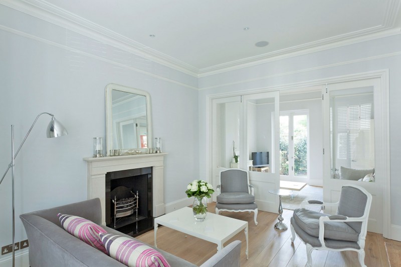 Floor Lamp Table Glossy Floor Lamp White Coffee Table And Cushy Sofa With Striped Pillows In Chic A Crisp White Home Classic Fireplace Apartments  Luminous And White Scandinavian Home With Exposed Eclectic Brick Facade