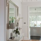 Flowers On Compact Precious Flowers On White Sideboard Compact White Kitchen Island Square Mirror In Silver Frame Glass Door Apartments Luminous And White Scandinavian Home With Exposed Eclectic Brick Facade