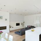 Wood Floor Sofa Rustic Wood Floor Dark Bed Sofa Floating TV Stand Modern Gas Fireplace Glass Pendant Lights White Kitchen Island In A Crisp White Home Apartments Luminous And White Scandinavian Home With Exposed Eclectic Brick Facade