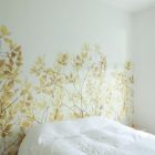 A Crisp Pretty Splendid A Crisp White Home Pretty Flower Wall Mural Comfortable White Bed Small Wood Bedside Table Apartments Luminous And White Scandinavian Home With Exposed Eclectic Brick Facade