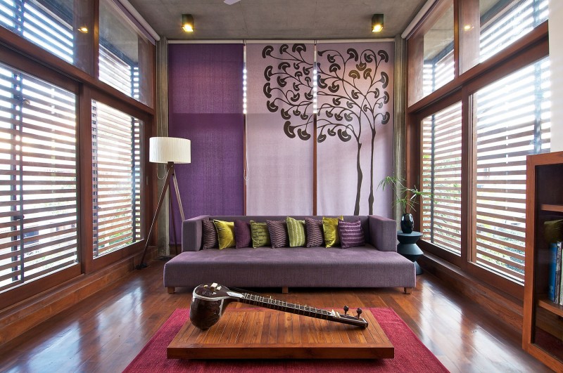 Pillows On Asian Unique Beautiful Pillows On Purple Sofa Asian Wood Coffee Table Decorated With White Floor Lamp And Sparkling Ceiling Lights Ornamental Plants In Sustainable Green House Decoration  Eco-Friendly Modern Green Home With Exposed Red Brick Walls