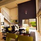 Bold Brown Set Contemporary Bold Brown Painted Wall Set As A Focal Point Inside House The Living Room With Double Height Ceiling Dream Homes Eclectic Contemporary Home In Hip And Vibrant Interior Style