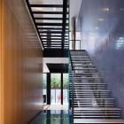 Lorber Tarler Staircase Enchanting Lorber Tarler House Geometric Staircase With Glass Railing High Gloss Finish Wood Wall Sleek Concrete Wall Shiny Ceiling Lights Dream Homes Old House Turned Into A Stylish Modern Residence For Urban Dwelling